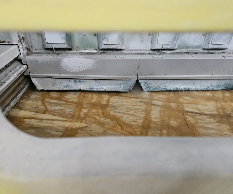 Finishing the edge — Giallo Siena marble in processing