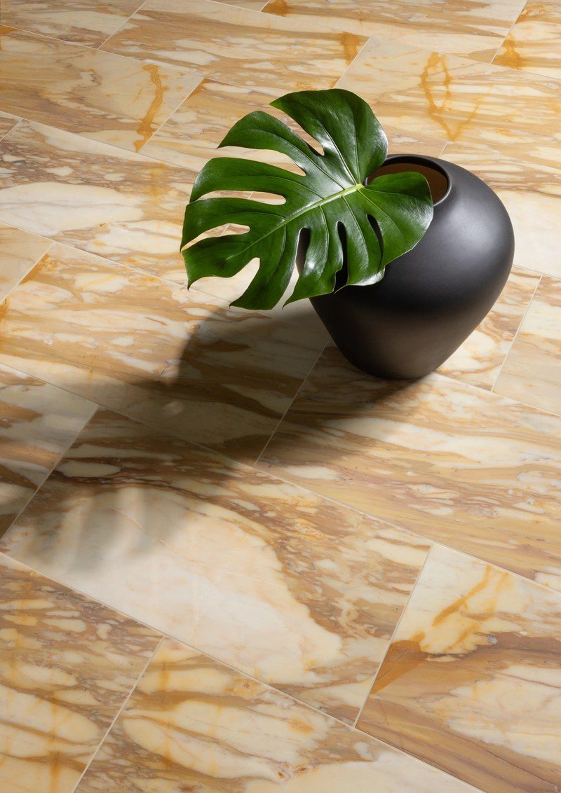 The stone used as a worktop surface, seen close enough for the polish and the depth of the ground to read.